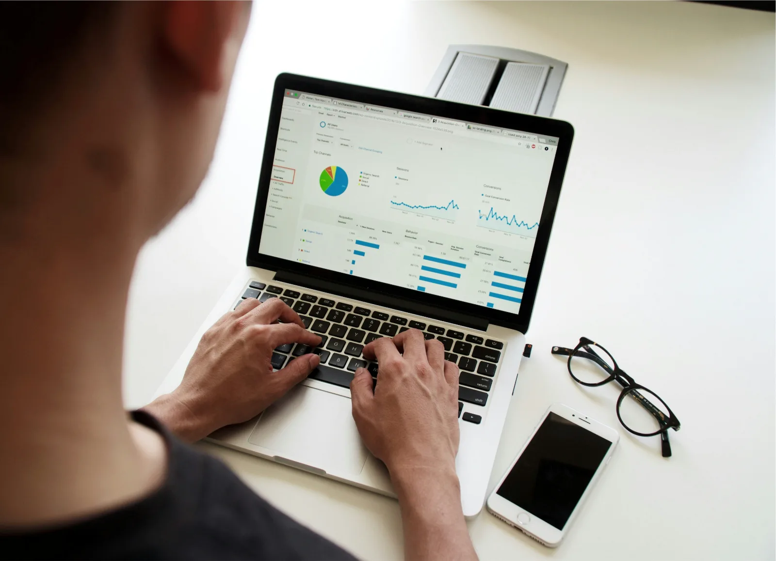 Person working through analytics dashboards on a laptop